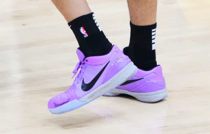 Devin Booker wears Nike Kobe 4 Protro on cover of NBA 2K23.